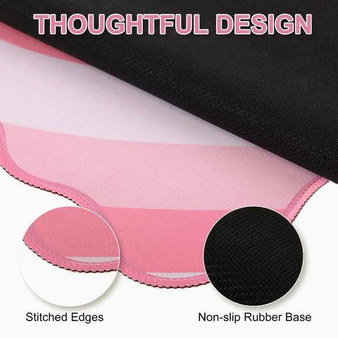 Close-up of pink heart XXL mouse pad with scalloped edge, showing non-slip rubber base, and stitched edges.