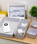 Customizable 8 Pack Felt Drawer Organizer Trays Set For Desk Drawers Shallow Modular Storage Bins For Office Supplies Makeup And Jewelry In Light Gray Mix And Match To Fit Any Drawer Like A Pro displayed on a desk holding various items.