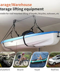 Heavy Duty Ceiling Hoist System For Garage Storage With Aluminum Construction, 125 Lb Capacity Overhead Lift for Kayaks in use