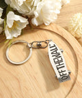 Skateboard Keychain Accessory Realistic Metal Deck Pendant For Men And Women with 'Off The Wall' text on white deck.