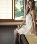 8 Piece Double Wheel Replacement Door Runners For Sliding Windows And Wardrobes Heavy Duty Pulleys shown on a bench beside a woman in a white dress.
