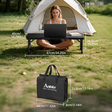 Woman using Three Foot Low Folding Picnic Table With Thick Aluminum Build, 10.3 Inch High, Lightweight Outdoor Table in front of tent