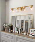 Gold Bathroom Vanity Light 28 Inch Four Light Fixture With Clear Glass Globes, Hand Painted Gold Finish above mirror