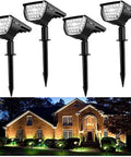 Solar Landscape Spotlight Kit With 32 LED Outdoor Wall Lights IP65 Waterproof 4 Pack illuminating a house facade at night