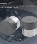 1.98 Inch Stainless Steel Wheel Bearing Protectors With Silicone Dust Cap, 2 Pack Built To Last, shown near trailer hub
