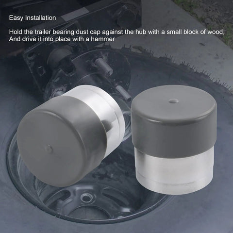 1.98 Inch Stainless Steel Wheel Bearing Protectors With Silicone Dust Cap, 2 Pack Built To Last, shown near trailer hub