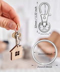 Premium Set Of One Hundred Heavy Duty Metal Swivel Lobster Clasps And Split Key Rings For Diy Lanyards Purses And Jewelry Crafting Hardware That Straight Up Will Never Let Go, showing keychain with wood house.