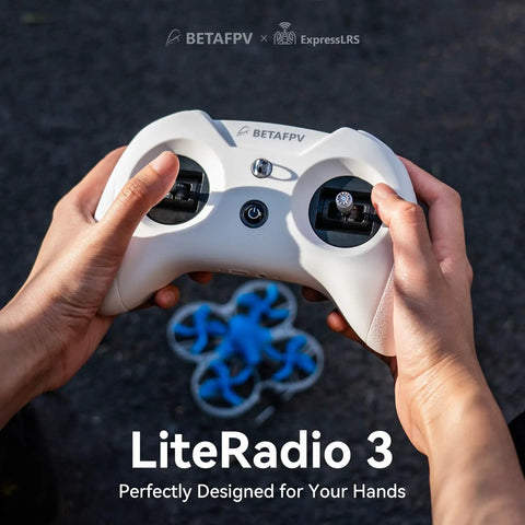 Person holding LiteRadio 3 Remote Control Transmitter with Nano Bay; FPV setup with drone in background.