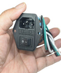 2 Pack IEC320 C14 Panel Mount Power Connector Socket 15A 250V in hand with 14 AWG copper terminals and switch visible