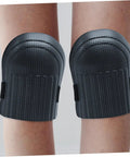 Hella Tough Dual Knee Guards For Mechanics And Tradesmen Job Site Ready Heavy Duty Protective Work Pads, black hard shell, close-up view.