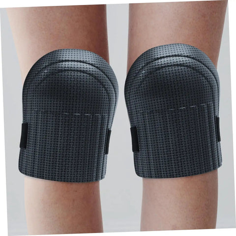Hella Tough Dual Knee Guards For Mechanics And Tradesmen Job Site Ready Heavy Duty Protective Work Pads, black hard shell, close-up view.