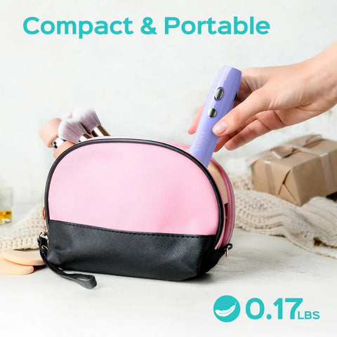 Cordless Electric Nail Drill With Stepless Speed Knob being placed into a pink makeup bag, showcasing portability and light weight.