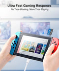Person inserting 64GB Micro SDXC Memory Card UHS-I Class 10 With 80 MB Per Second Read And 20 MB Per Second Write Speed into gaming console.