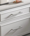 Close-up of white cabinet with 40 Pack 3 Inch Brushed Nickel Cabinet Pulls Square Drawer Handles For Kitchen Cabinets Cupboards And Dresser