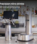 Top Shelf Electric Nitro Cold Brew Coffee And Cocktail Brewer For Casual Home Mixologists next to a stainless steel nitro drink maker.