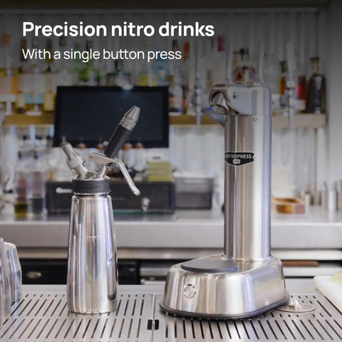 Top Shelf Electric Nitro Cold Brew Coffee And Cocktail Brewer For Casual Home Mixologists next to a stainless steel nitro drink maker.