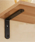 No Nonsense Heavy Duty L Shaped Corner Brackets For Floating Shelves mounted under wooden shelf, matte black metal support.