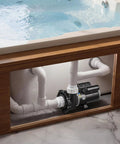 Workhorse 3Hp TwoSpeed Hot Tub Pump For Spas With Smooth 48Frame Build And Dual 1Point5 And 2Inch Ports At 230V installed under a hot tub, showing plumbing connections.
