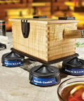 Wooden box elevated on Bench Cookies Finishing Cones 4 Pack For Woodworking Snug Fit Over Work Grippers, Fail Safe Project Finishing System, Cones Nest For Easy Storage, Router Accessories during varnishing process.