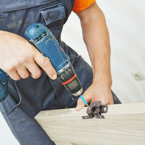 Heavy Duty 20 Piece Cabinet Door Latch And Catch Kit In Rich Brown Antique Copper Finish Solid Galvanized Steel being installed with a drill.