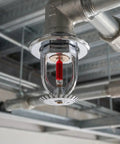 Top Notch 10 Pack Fire Sprinkler Heads Crafted From Heavy Duty Copper With Quick Response Activation At 155 Degrees Fahrenheit And Half Inch Thread Mount For Instant Downward Water Spray To Knock Back Flames Across Your Home Or Workshop Setup, showing a mounted fire sprinkler head.