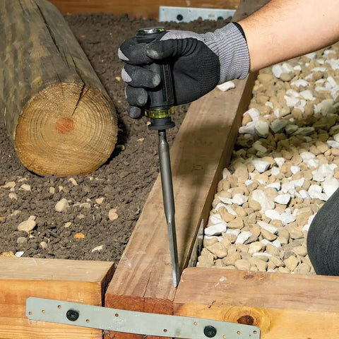 Worker using SDS Demolition Screwdriver Set With Flat Chisel And Bull Point Tips For Rotary Hammer Drills in garden construction