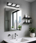 No Sweat Dimmable Led Bathroom Light Fixture Three Bulb Vanity Wall Lamp with matte black frame above sleek bathroom mirror.