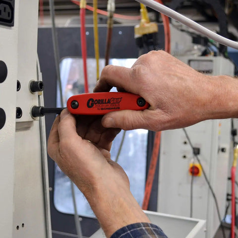 Person using GorillaGrip Fold Up Hex And Torx Set Triple Pack With Color Coded Handles for machinery repair