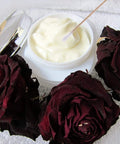 Jar of cream with Extra Long Six Inch Wooden Cotton Swabs 200 Count Industrial Grade Cotton Tipped Applicators near dried roses.