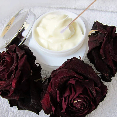 Jar of cream with Extra Long Six Inch Wooden Cotton Swabs 200 Count Industrial Grade Cotton Tipped Applicators near dried roses.