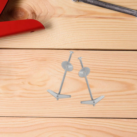 Close-up of Heavy Duty Toggle Bolts And Wing Nut Kit 15 Sets Carbon Steel Wall Anchors on wood surface with tools.