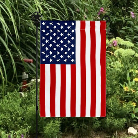 All American Fourth Of July Garden Flag Outdoor Decor Made In The USA Premium Poly Poplin Weather Resistant Double Sided Fade Resistant Patriotic Stars And Stripes Flag For Patio Lawn Yard displayed amidst garden greenery.