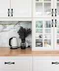 Four Pack Black Arch Cabinet Handles With Slick Marble Finish And Crystal Glass For Kitchen Drawers Bathroom Vanities And Furniture 5.6 Inch Pulls on white kitchen cabinetry.