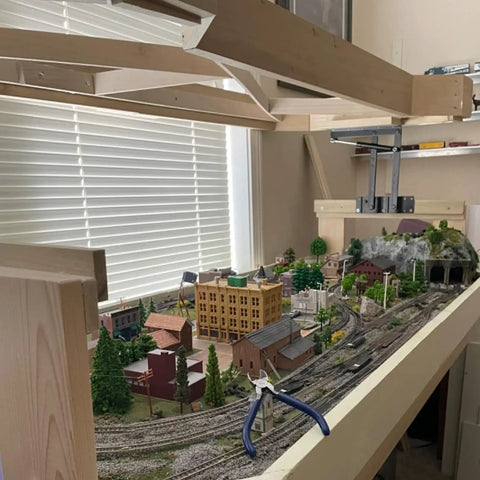 Heavy Duty Two Piece Lift Up Coffee Table Mechanism With Smooth Gas Spring Hinge Support Bracket Hydraulic Floating Desktop Riser Kit on a model train setup.