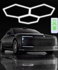 Hexagon Garage Lights 16 Pack Plug And Play LED Panels, installed above a car with remote control, 24W 6500K lighting