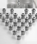Premium 25 Piece Er32 Spring Collet Set With 1/16 To 13/16 Inch Clamping Range arranged on a table for precision machining.