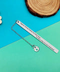 Funny Engineer Gift For Mechanical And Design Engineers stainless steel bookmark with gear charm on blue and wood background