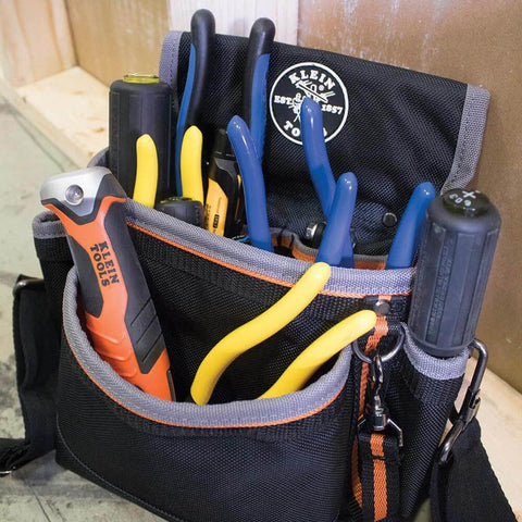 Front view of Klein Tools tool bag with blue and yellow pliers and screwdrivers