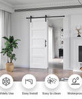 White 30x84 Inch Sliding Barn Door With 5.5 Ft Hardware Kit Included Solid MDF Slab With Waterproof Scratch Resistant PVC Surface DIY Easy Install Space Saving 5 Panel Door installed in living room