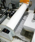 Straight Up Tough Industrial Filter Paper Roll For Machine Oil Cleanup Efficiently Snags Metal Shavings And Sludge In Wastewater With Massive Dirt Capacity Coarse Grade 3 X 328 Feet installed on a machine.