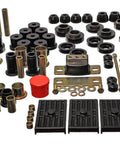 Heavy Duty Chevrolet Camaro Polyurethane Suspension Bushing Replacement Kit In Standard Black displayed with various bushings and parts.