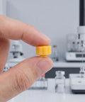 70 Pack Plastic Luer Lock Syringe Needle Tip Caps For Lab And Industrial Use Airtight Seal Easy Grip Leakproof Storage For Safe Sample Handling And Quick Dispensing, yellow cap held by hand