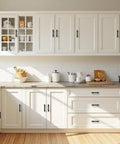 Matte Black Cabinet Pulls 5 Pack With 2.5 Inch Hole Centers installed on white kitchen cabinets and drawers.