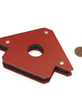Red metal welding magnet from 4 Pack Magnetic Welding Holders With 25 Lb Holding Power For Metalworking, shown next to a penny for scale.
