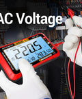 Hand holding Auto Ranging Digital Multimeter With Large LCD Display And 4000 Count Voltage Tester TRMS Volt Meter showing AC voltage