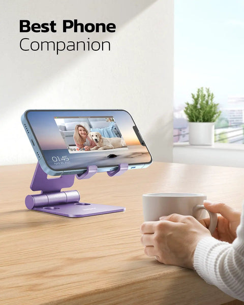Dual Folding Phone Stand With Fully Adjustable Angles For IPhone 17 16 15 14 13 12 11 Pro Max Xs Xr X 8 And Nintendo Switch Desktop Cradle Dock All Phones Purple on desk with phone