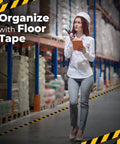 Woman in warehouse with 2 Inch By 108 Foot Black And Yellow Floor Safety Tape With Heavy Duty Adhesive Waterproof And Tear Resistant