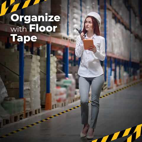 Woman in warehouse with 2 Inch By 108 Foot Black And Yellow Floor Safety Tape With Heavy Duty Adhesive Waterproof And Tear Resistant