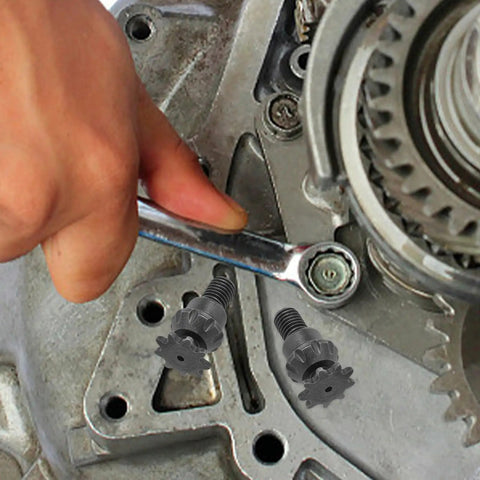 Heavy Hitter Iron Motorcycle Transmission Gear Reduction Unit For Mini Bikes Atv And Hot Rods Pumping Out Serious Torque And Dependable Power Distribution close-up of installation process with wrench and dark grey bolts.
