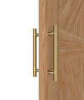 Titanium Gold Round Barn Door Handles Set, Double Sided Pull Push for French Doors and Exterior Shower Doors, installed on wooden door.